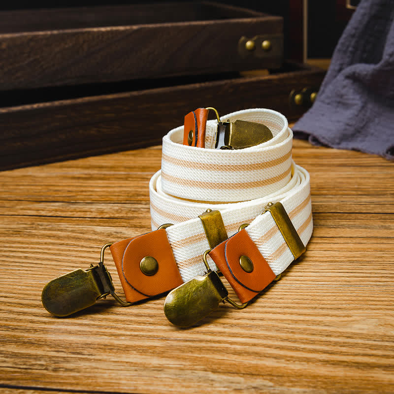 Saubere weiße gestreifte Hosenträger mit elastischen Riemen und X-Rücken