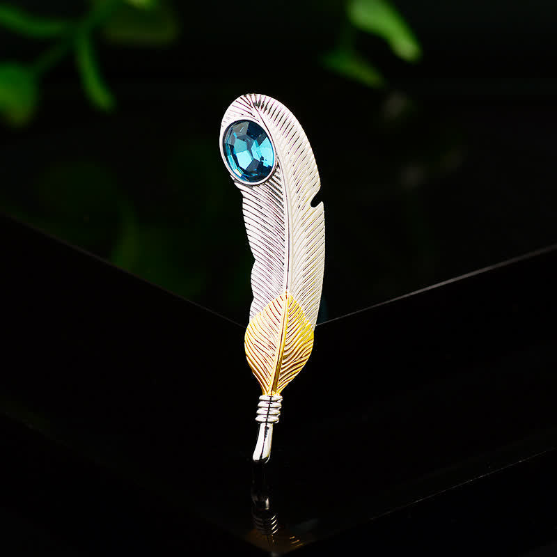 Unisex-Brosche in Federform mit Kunstkristall in Blau