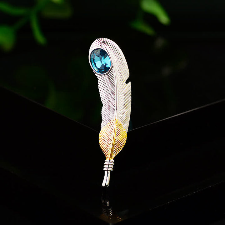 Unisex-Brosche in Federform mit Kunstkristall in Blau