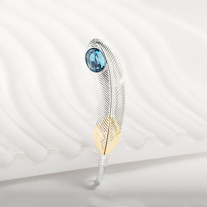 Unisex-Brosche in Federform mit Kunstkristall in Blau