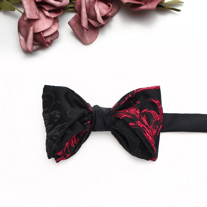 Fliege für Herren mit schwarzem und rotem Weinranken-Blumenmuster