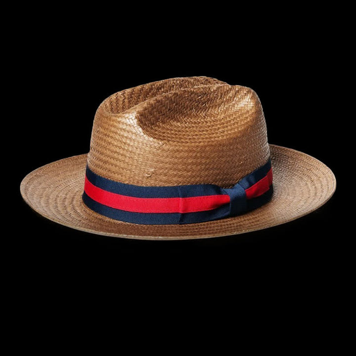 Dekorativer roter und marineblauer Cowboystrohhut mit Band