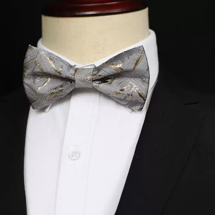 Zeitlose, zarte goldene Jacquard-Fliege für Herren