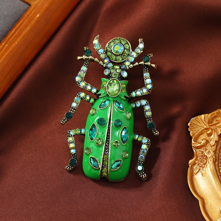 Antike große Emaille-Brosche mit Skarabäus-farbigem Kristall