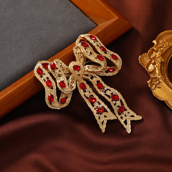 Ausgefallene Brosche mit Schleife und Knoten aus gewelltem Metallband für Damen in Gold
