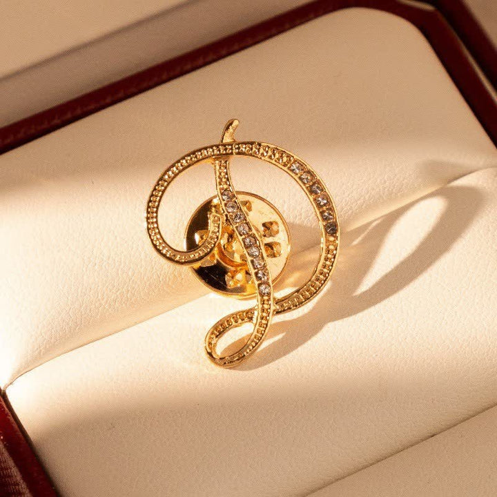 Goldfarbene Brosche mit Strasssteinen im Alphabet-Stil mit Anfangsbuchstaben 26