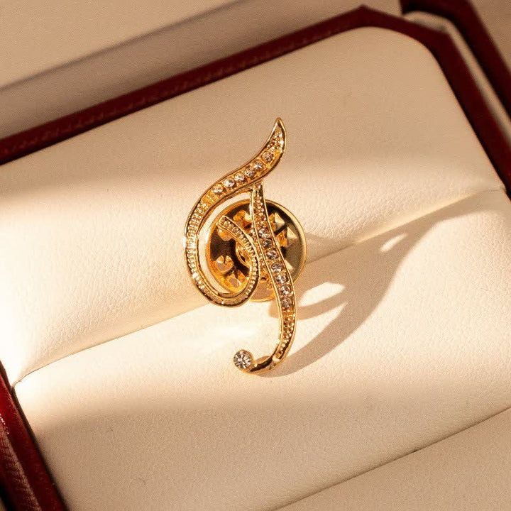 Goldfarbene Brosche mit Strasssteinen im Alphabet-Stil mit Anfangsbuchstaben 26