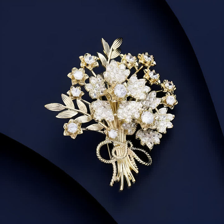 Damen-Brosche mit goldenen Strasssteinen und Blumenstrauß