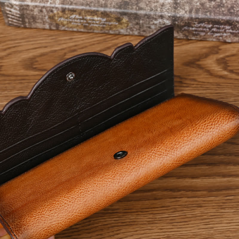 Lange, dreifach gefaltete Lederbrieftasche für Damen mit Blumenmuster und Handschlaufe