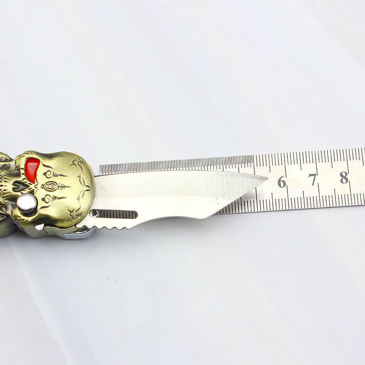 Nachfüllbares Butanfeuerzeug mit drei Totenkopfköpfen und Messer - image 11