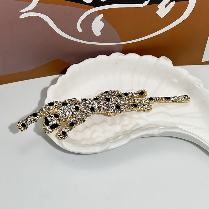 Bewegliche Brosche mit Gepardenmotiv und Diamantbesatz in Schwarz - Golden - image 0