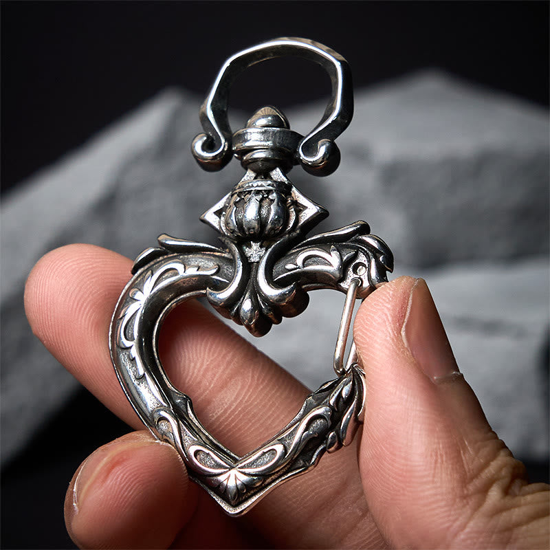 Drehbarer Vintage-Schlüsselanhänger aus poliertem Metall in Herzform - image 1