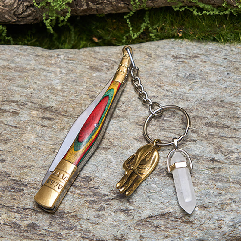 Outdoor-Klappmesser mit farbenfrohem Griff und weißer Buddha-Hand-Halskette aus Kristall - image 2