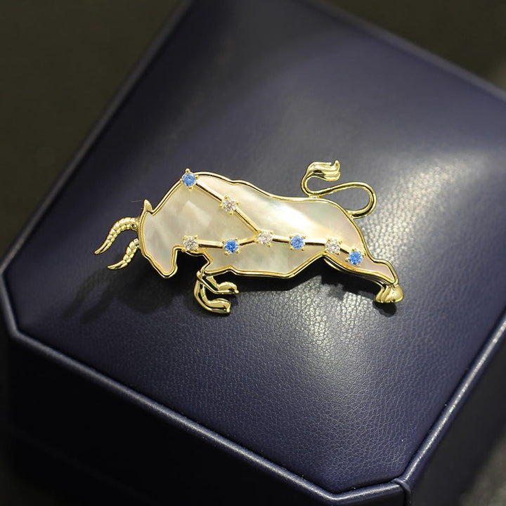 Brosche mit 12 Sternbildern aus Perlmutt und blauem Kristall in Gold - image 3