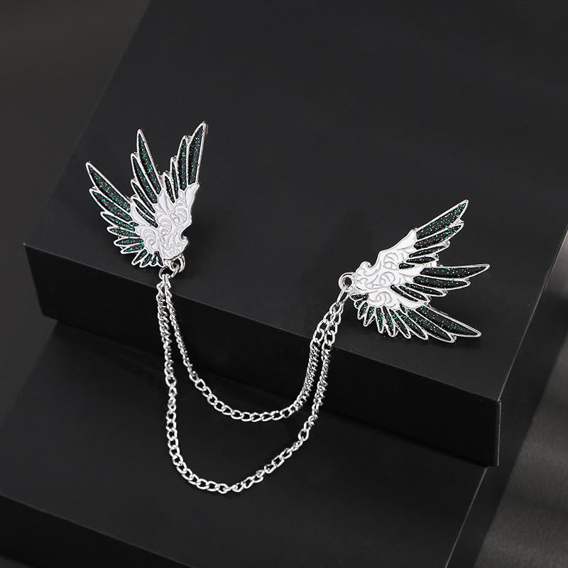 Verzierte, symmetrische Doppelkettenbrosche mit Flügelpaar. - image 1