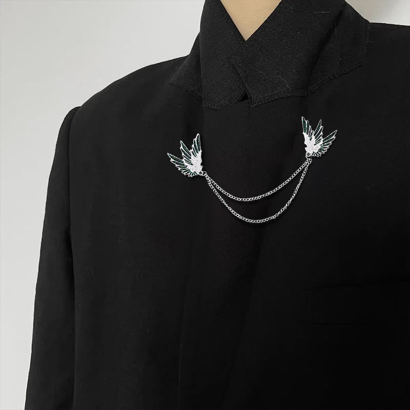 Verzierte, symmetrische Doppelkettenbrosche mit Flügelpaar. - image 2