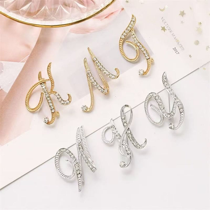 Brosche mit Diamantenbesatz an Initialen aus Gold und Silber - image 2