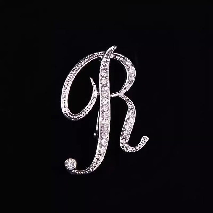 Brosche mit Diamantenbesatz an Initialen aus Gold und Silber - Silber - R - image 40