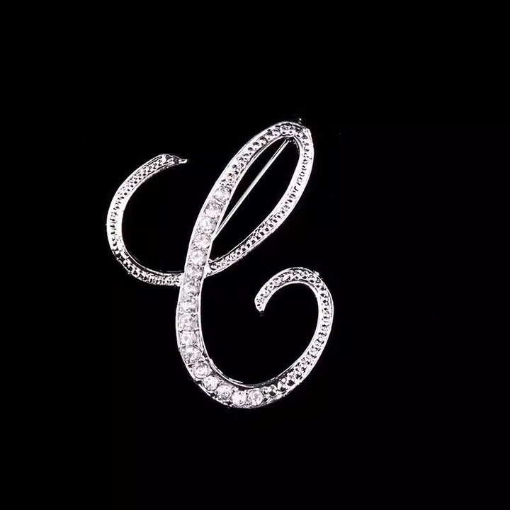 Brosche mit Diamantenbesatz an Initialen aus Gold und Silber - Silber - C - image 25