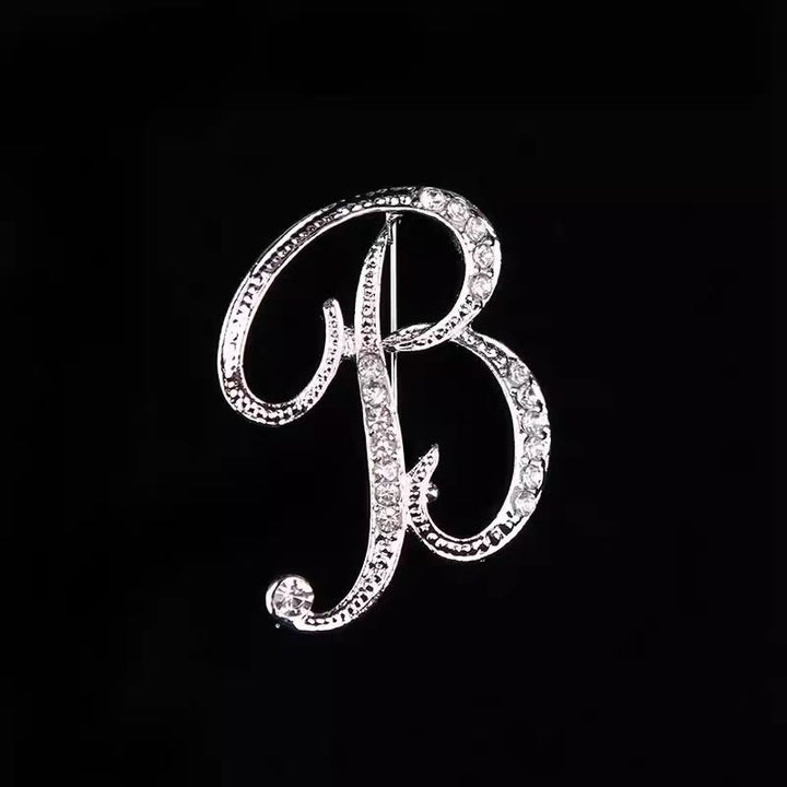 Brosche mit Diamantenbesatz an Initialen aus Gold und Silber - Silber - B - image 24
