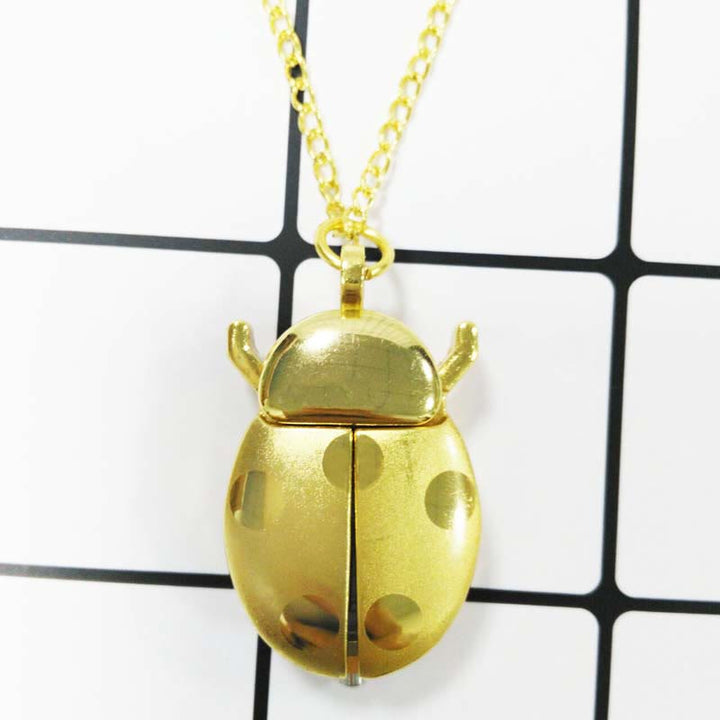 Antike Taschenuhr mit klappbaren Flügeln in Form eines Skarabäus - Goldene Halskette - image 9