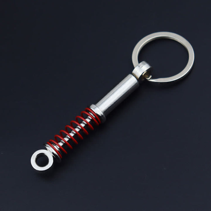 Mini-Schlüsselanhänger-Kollektion im modernen Autoteile-Design - Roter Stoßdämpfer - image 15