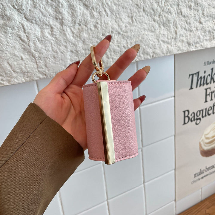 Faltbare Nylon-Schultertasche mit Schlüsselanhänger und Lederakzenten - image 20