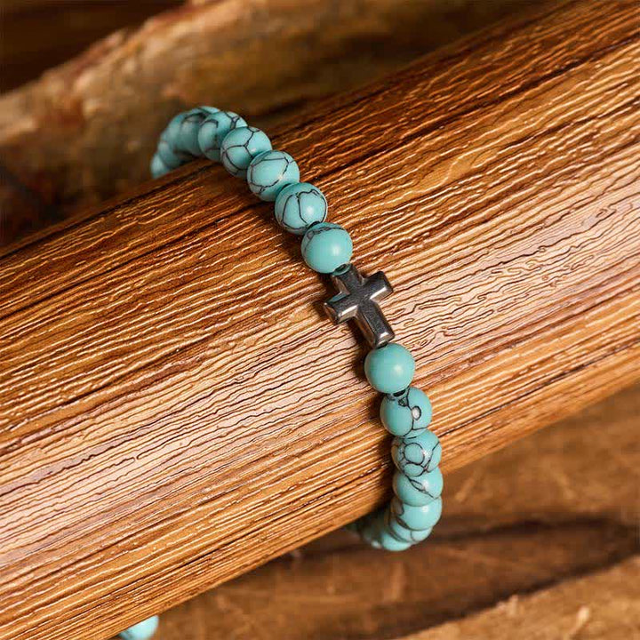 Armband mit türkisfarbenen Perlen und verstellbarem Anhänger mit Glaubenskreuz - image 1